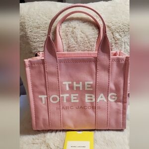 Marc Jacobs Light Pink Small Canvas Tote With Handles and Black Shoulder Strap.